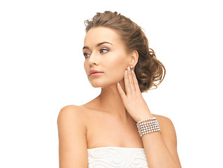 Image showing woman with pearl earrings and bracelet