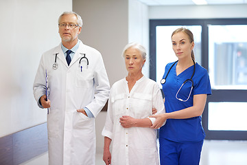 Image showing medics and senior patient woman at hospital