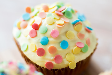 Image showing close up of glazed cupcake or muffin on table