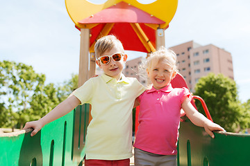 Image showing two happy kids hugging on children playground