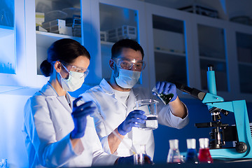 Image showing close up of scientists making test in lab