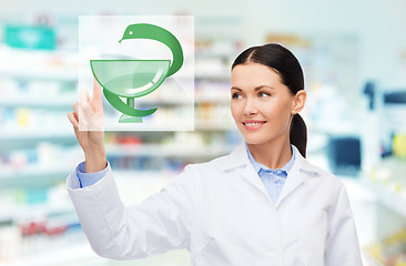 Image showing young woman pharmacist drugstore or pharmacy