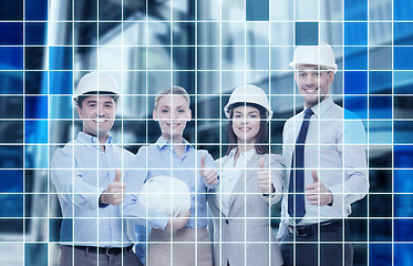 Image showing happy business team in office showing thumbs up