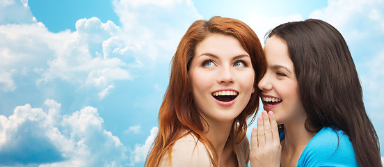 Image showing teenage girls or women whispering gossip