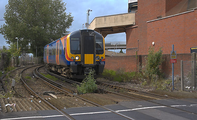 Image showing Train Departing Station