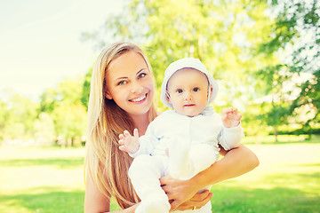 Image showing happy mother with little baby in park