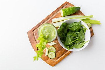 Image showing close up of fresh green juice glass and celery