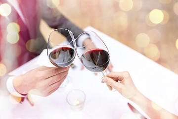 Image showing young couple with glasses of wine at restaurant