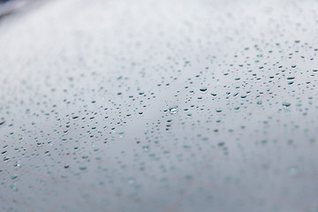 Image showing close up of wet rear car glass