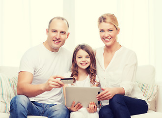 Image showing parents and girl with tablet pc and credit card