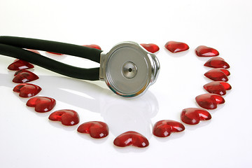 Image showing Stethoscope with red decoration hearts