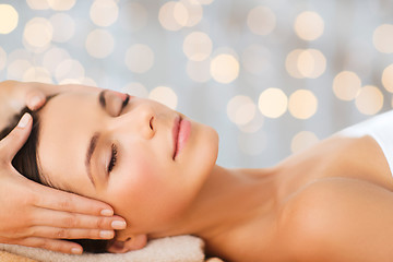 Image showing beautiful woman in spa salon having facial massage