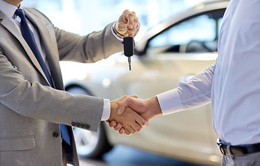 Image showing close up of handshake in auto show or salon