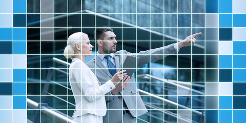 Image showing serious businessmen with tablet pc outdoors