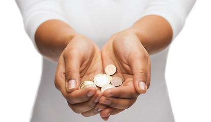 Image showing womans cupped hands showing euro coins