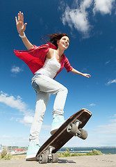 Image showing teenage girl skating outside