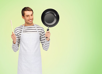 Image showing happy man or cook in apron with pan and spoon