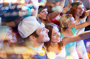 Image showing smiling friends at concert in club