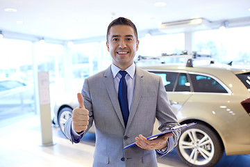 Image showing happy man at auto show or car salon