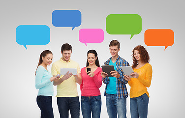 Image showing group of teenagers with smartphones and tablet pc