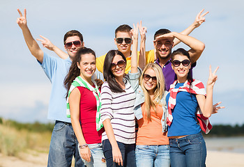 Image showing group of happy friends having fun on beach