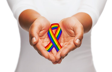 Image showing hands holding rainbow gay pride awareness ribbon