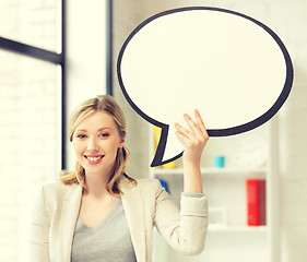 Image showing smiling businesswoman with blank text bubble