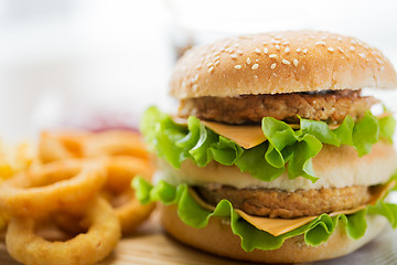 Image showing close up of hamburger or cheeseburger on table