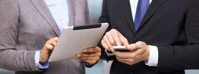 Image showing two businesspeople with smartphone and tablet pc