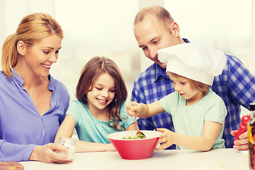 Image showing happy family with two kids eating at home