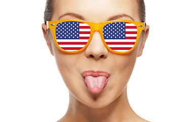 Image showing happy teenage girl in shades with american flag