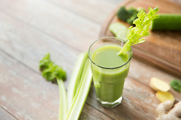 Image showing close up of fresh green juice glass and celery