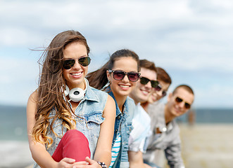 Image showing smiling teenage girl hanging out with friends