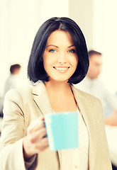 Image showing beautiful businesswoman with cup of coffee