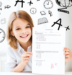 Image showing girl with test and A grade at school