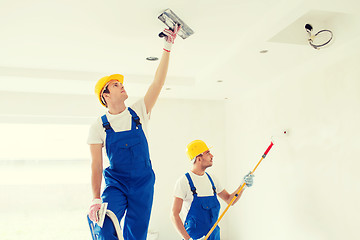 Image showing group of builders with tools indoors