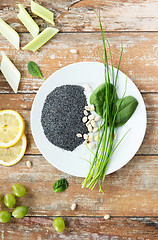 Image showing close up of peanut, greens and poppy or chia seeds