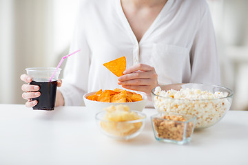 Image showing close up of woman with junk food and coca cola cup