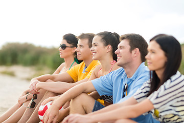 Image showing group of happy friends on beach