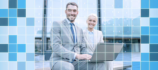 Image showing smiling businesspeople with laptop outdoors