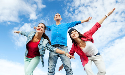 Image showing group of teenagers spreading hands