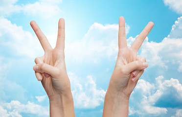 Image showing woman hands showing victory or peace sign