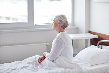 Image showing senior woman patient lying in bed at hospital ward