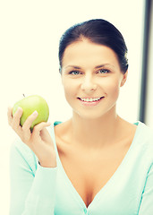 Image showing beautiful woman in the with an apple