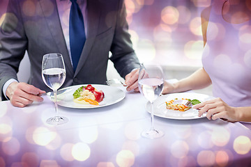 Image showing close up of couple eating appetizers at restaurant