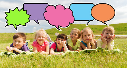 Image showing group of kids lying on blanket or cover outdoors