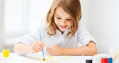 Image showing little girl painting at school