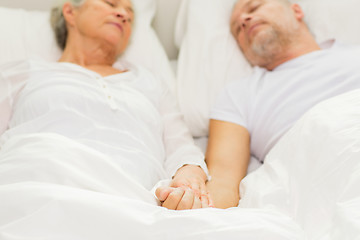 Image showing close up of senior couple sleeping in bad at home