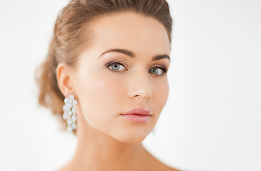 Image showing woman wearing shiny diamond earrings