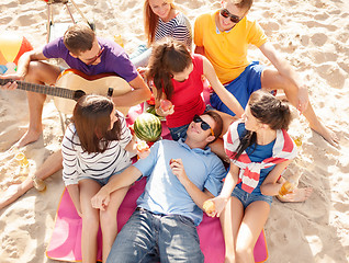 Image showing group of happy friends having fun on beach